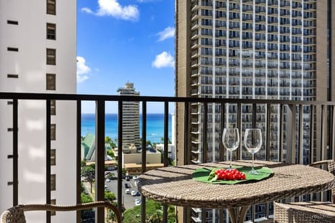 Step through the glass doors onto your private balcony, set up with a delightful bistro table and chairs, where you can sip your favorite drink and enjoy that beautiful view of the city and the sparkling ocean!