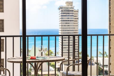 Step through the glass doors onto your private balcony, set up with a delightful bistro table and chairs, where you can sip your favorite drink and enjoy that beautiful view of the city and the sparkling ocean!