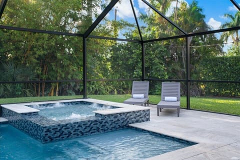 Backyard Bliss, Relax by the spa with views of the serene bamboo