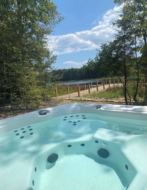 Relax in the 7 seater hot tub while soaking up lake views.