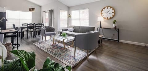 Enjoy soaring ceilings and a bright, airy living room that feels spacious and inviting. A perfect space to relax, unwind, and gather with friends or family during your stay.