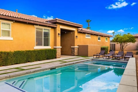 Your private backyard features a pool, comfortable loungers and space to relax.