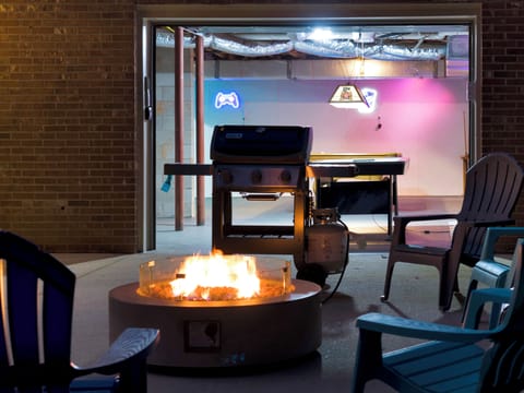 Outdoor fire pit, propane grill, chairs . . . leading right into game room!