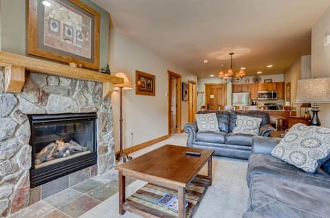 Comfortable living area with a stone fireplace and warm ambiance.