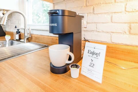 Our kitchen has all the comforts of home, including a Keurig coffee maker with starter coffee pods, tea packets, creamer, and sugar to kickstart your mornings during your stay.