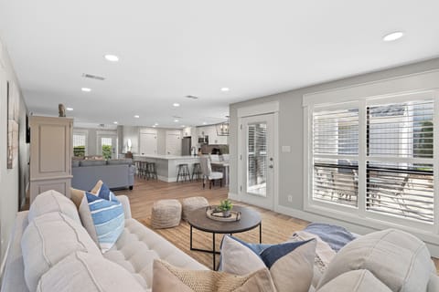 Designed for gathering and unwinding alike, this bright open-concept living space brings everyone together in effortless coastal comfort.