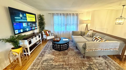 Cozy living room with open concept to kitchen and dining area