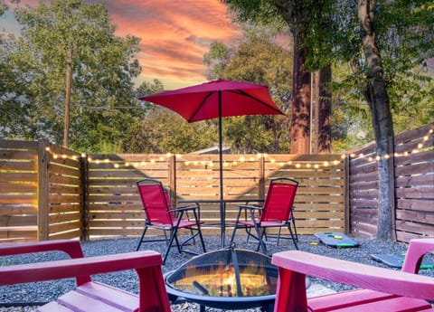 Outdoor dining area, fenced yard, fire pit, game