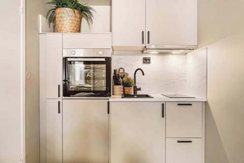 Make easy meals at home with a modern kitchen, oven, and essentials.