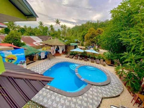 Outdoor pool, pool umbrellas, lifeguards on site