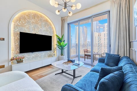 Deluxe Apartment, City View | Living area | 65-inch flat-screen TV with cable channels