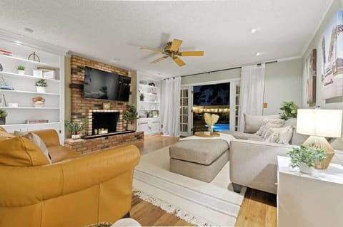 ✨  This beautifully designed 1,476 sq. ft. retreat features a warm brick accents, built-in shelving, and an inviting open-concept layout. Relax by the fireplace or step outside to enjoy the poolside ambiance. Your dream getaway starts here! 