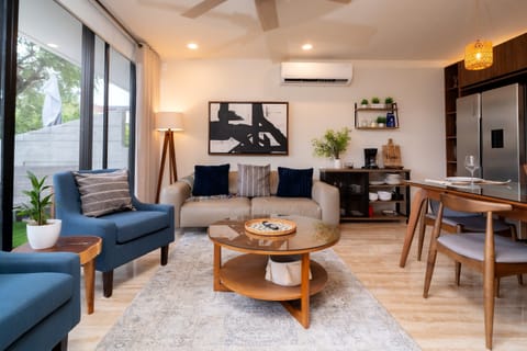 Bright open living room in E206 at AWA Playacar