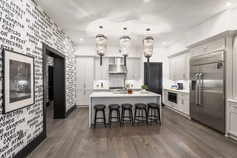 Cook or snack in style with a full kitchen featuring GE stainless appliances, cookware, and an island with bar seating. Ideal for short or extended stays, our kitchens make group travel in New Orleans easy and comfortable.