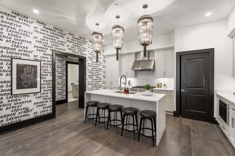 Cook or snack in style with a full kitchen featuring GE stainless appliances, cookware, and an island with bar seating. Ideal for short or extended stays, our kitchens make group travel in New Orleans easy and comfortable.