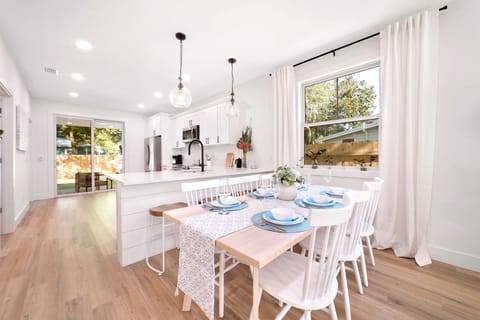 This open-concept dining area invites you to unwind with calming blue accents