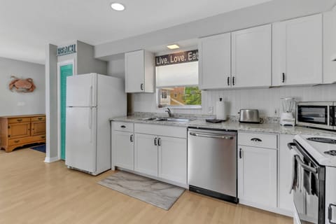 Cookware, dinnerware and many kitchen tools and gadgets are provided.