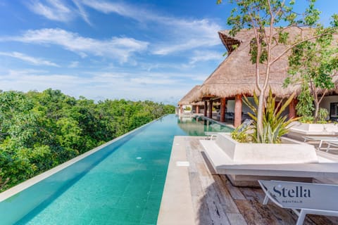 Rooftop pool, jungle views. Grab a dip, cool off. Tulum done right.