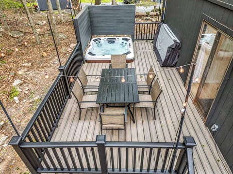 Spacious deck with outdoor dining and easy access to the hot tub.