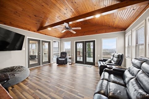 Panoramic views and soaring wood-plank ceilings.