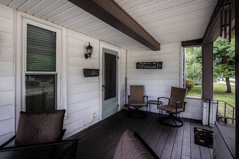 The Front Porch - Covered front porch with dining table and seating