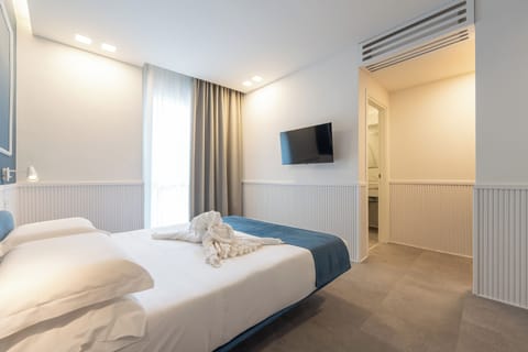 Deluxe Double Room, Balcony, City View | In-room safe, blackout drapes, soundproofing, iron/ironing board