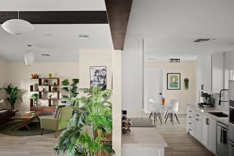 Gather and cook in this open-concept space that blends kitchen and living areas with easy desert style.