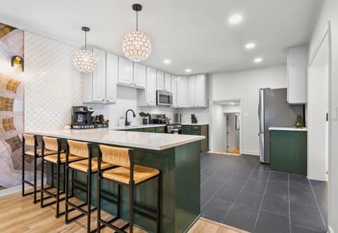 This modern kitchen has everything you need for preparing meals, with plenty of space and stylish finishes.