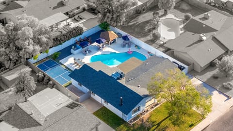The Full Picture - Every amenity laid out before you — pool, sports court, outdoor living spaces, and room to breathe. This property delivers on every level.
