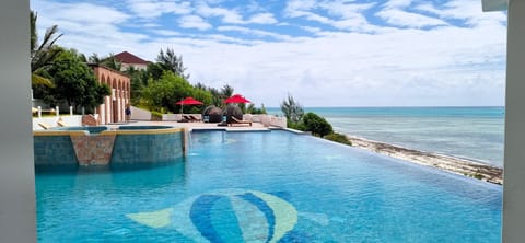 3 outdoor pools, open 7:00 AM to 6:00 PM, pool umbrellas