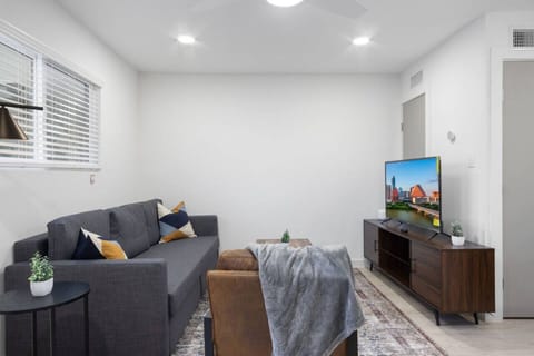 You feel at home as you settle into the living room, where the inviting atmosphere is perfect for lounging or entertaining.