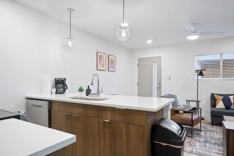 The kitchen’s open layout allows you to move freely as you prepare meals, with everything you need at your fingertips.