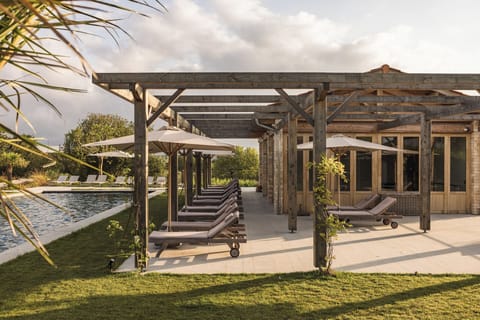 Seasonal outdoor pool, open 9:00 AM to 8:00 PM, pool umbrellas
