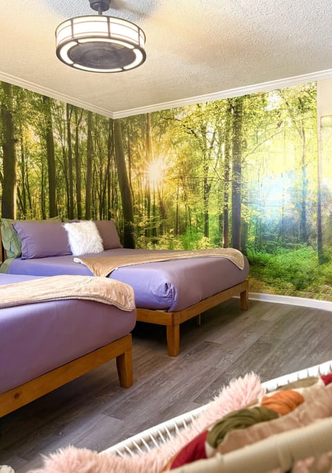 Relax in a serene forest-inspired Catskills bedroom with plush bedding, calming woodland décor, and cozy mountain charm near Belleayre and endless outdoor adventures.