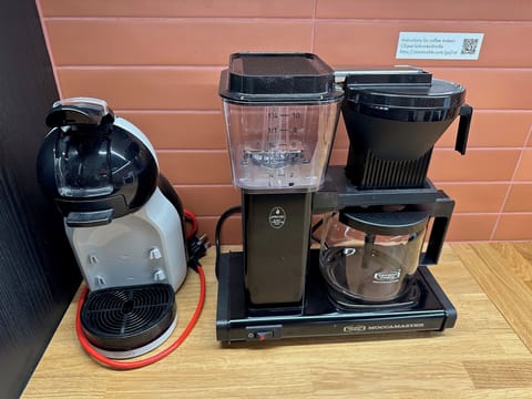 Two coffee makers, with free coffee for guests