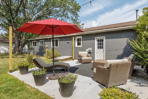 A serene backyard retreat featuring lush greenery and a tranquil atmosphere, perfect for relaxation and enjoying nature.