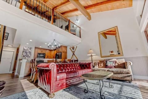 Living Room: 3-person couch, loveseat, chair, 50” Smart TV, gas fireplace, access to balcony