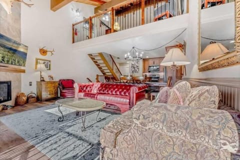 Living Room: 3-person couch, loveseat, chair, 50” Smart TV, gas fireplace, access to balcony