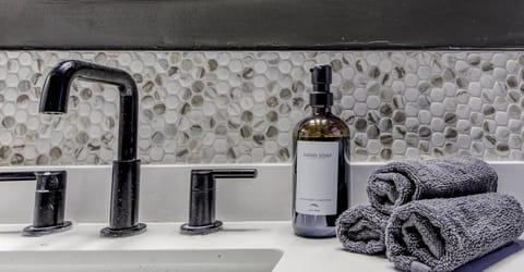Refresh and unwind in this modern bathroom, featuring stylish design, soft lighting, and a spa-like ambiance.