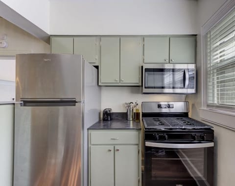 A fully equipped kitchen for all your cooking needs! Enjoy the convenience of modern appliances in a stylish, inviting space.