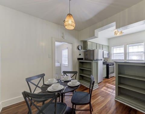 Start your day with coffee in this cozy dining area, where modern comfort meets practical design, just steps from your bedroom and kitchen.