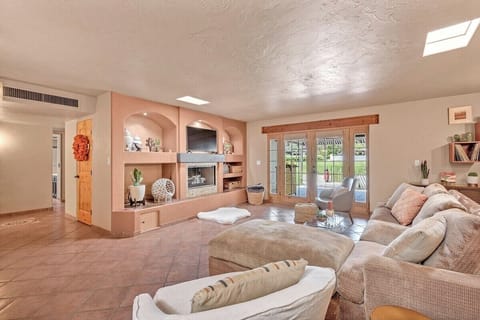 Living Space with gas fireplace and view of the 11th hole Dorado Golf Course