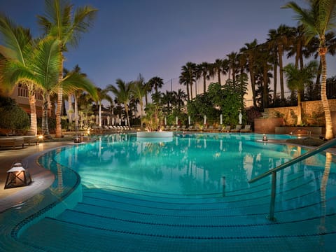 Indoor pool, outdoor pool, pool umbrellas, sun loungers