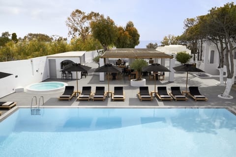 Seasonal outdoor pool, open 11:00 AM to 8:30 PM, pool umbrellas