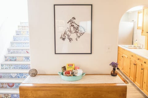 The dining table has two drop-leaves; pull up some chairs for a seating of 6!