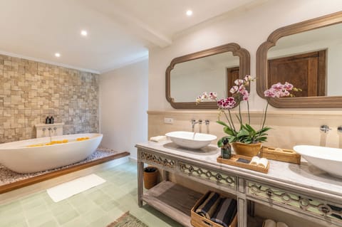 Separate tub and shower, rainfall showerhead, eco-friendly toiletries