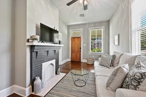 When you open the door, you will be welcomed into the cozy living room. 