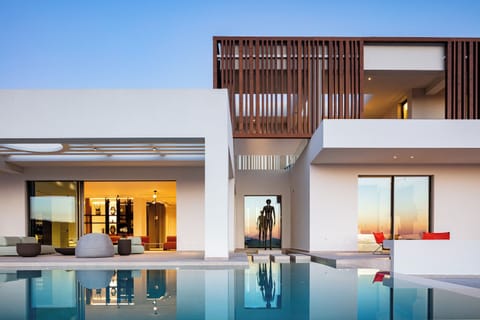 As you step into this exquisite retreat, you are immediately enveloped by the harmonious blend of natural elements with the breathtaking landscape of Crete.