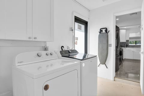 This bright and airy room features a modern washer and dryer, making it easy to keep your wardrobe fresh during your stay.