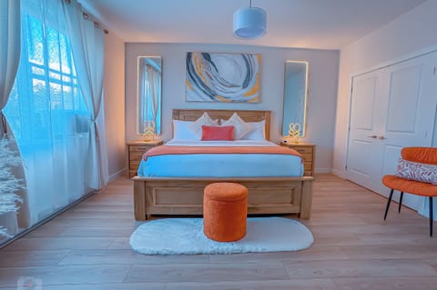 This bedroom has a king-size bed and an ensuite bathroom with a shower